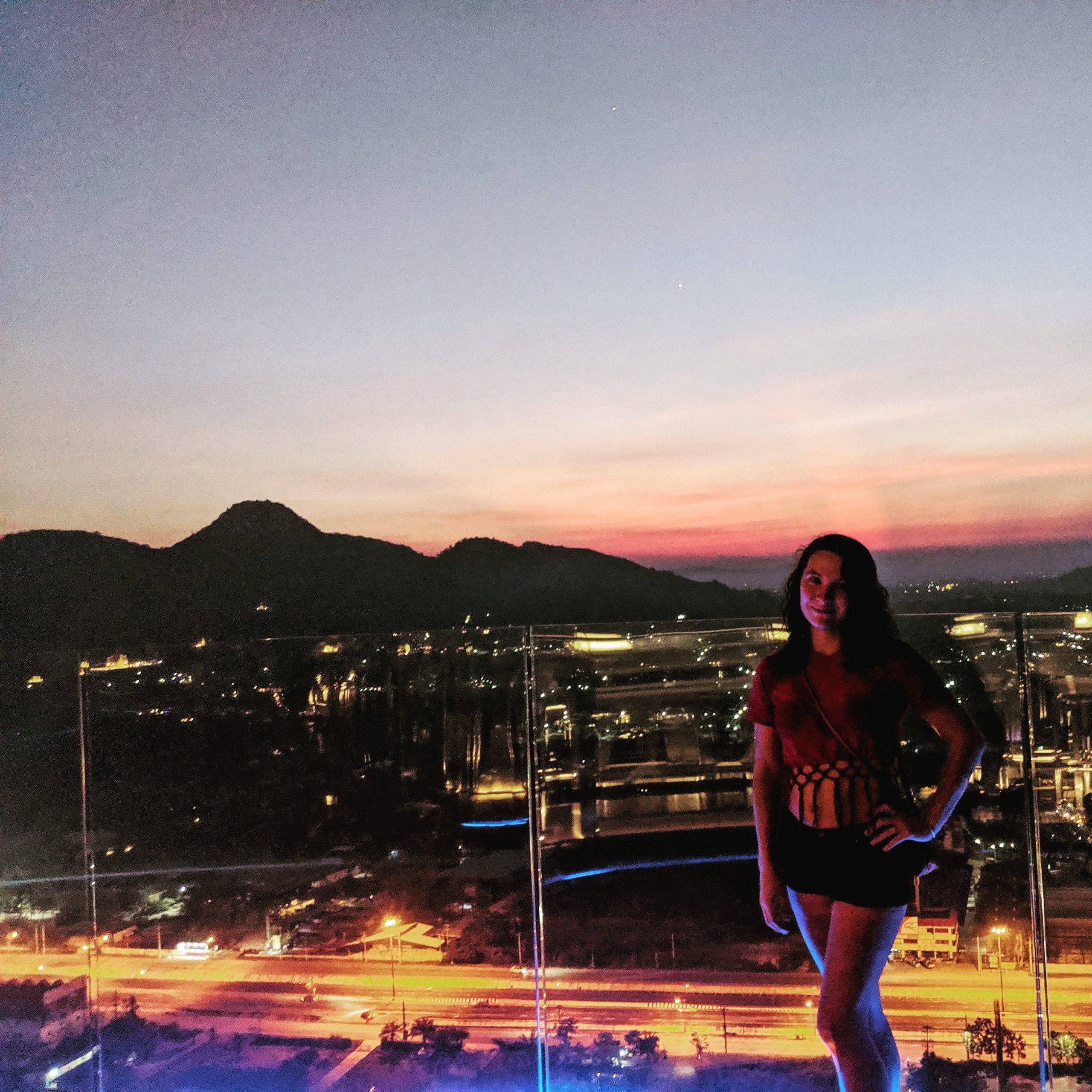 sunset over mountain and city