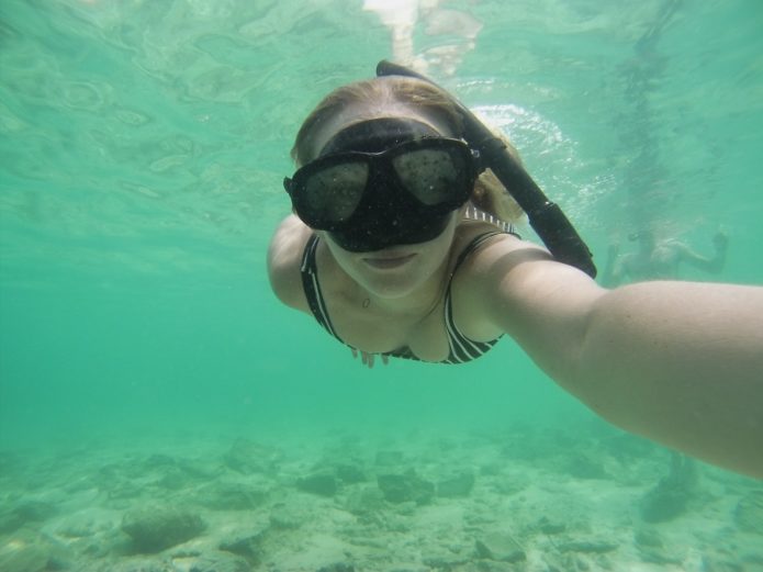 Snorkeling in these serene crystal blue waters.