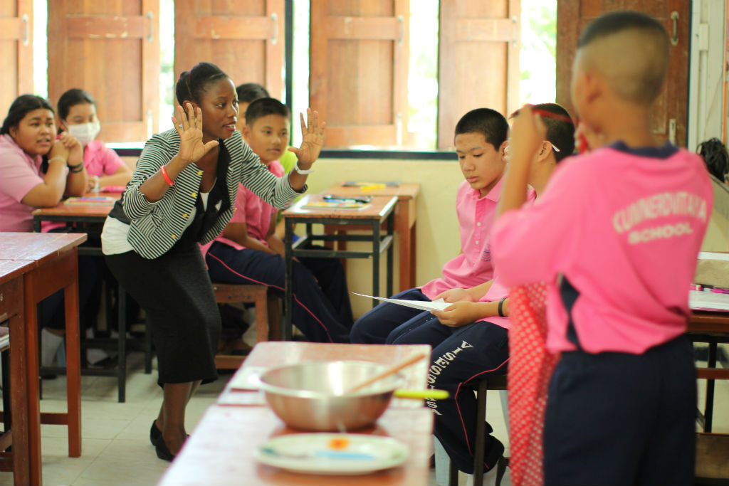 Teacher with her students in Thailand