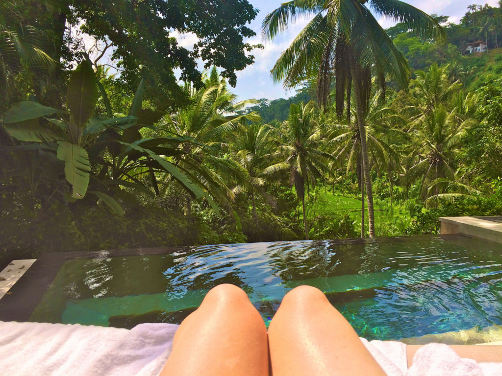Lying next to the pool in Ubud Bali