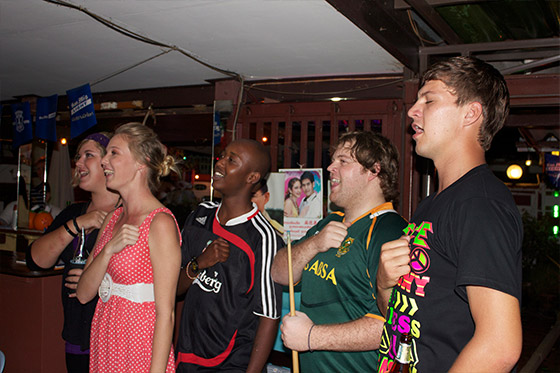 South African expats singing the national anthem in a bar in Thailand