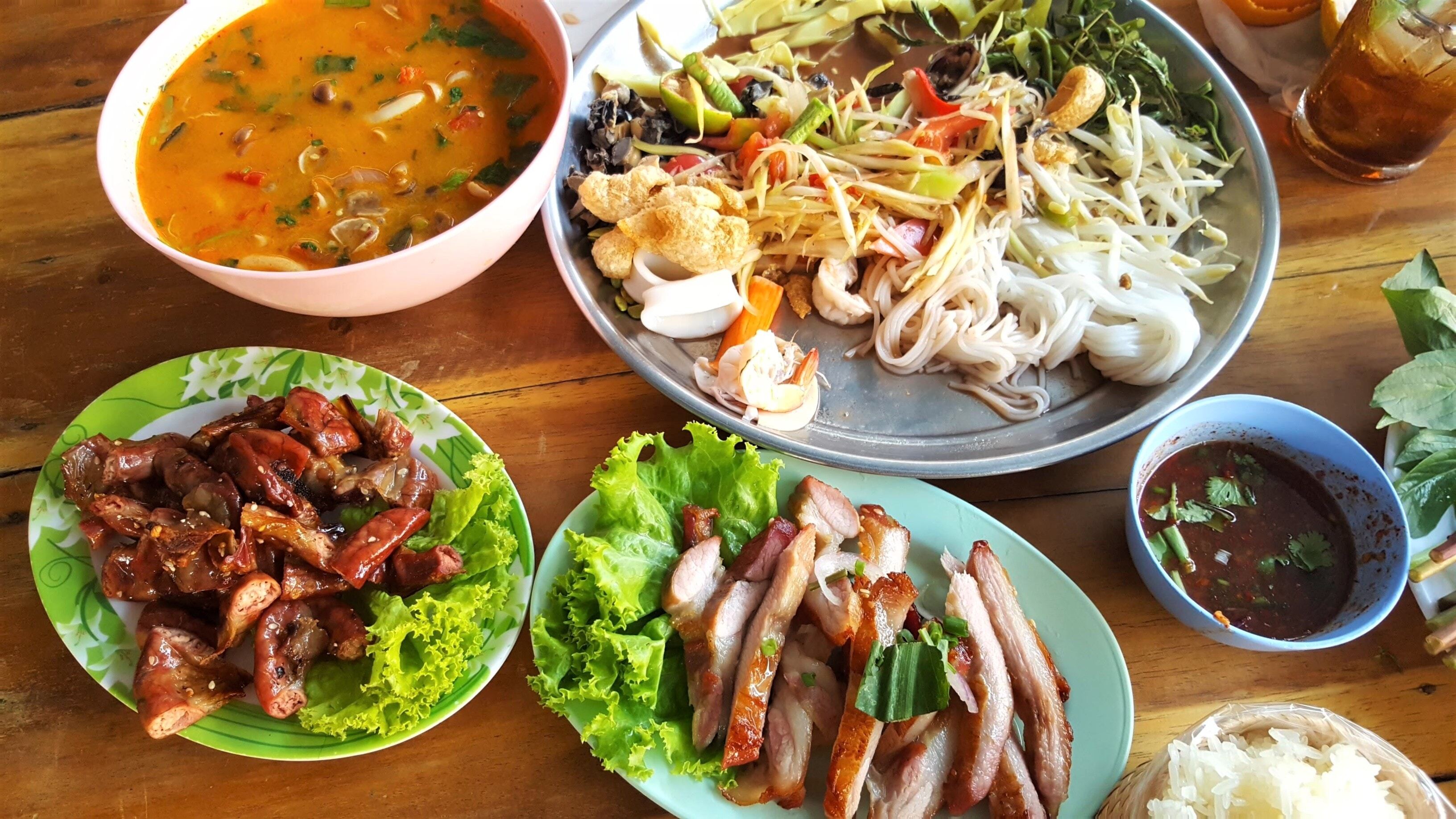 Papaya salad, known as Som Tam in Thailand, is a delicious Thai dish you must try