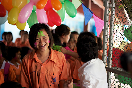 Thai student celebrating the colour festival in Thailand