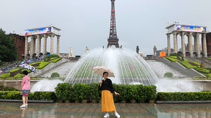Person in front of fountain in Shenzhen, China.