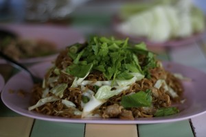 One of the many local Thai dishes one can purchase from restaurants in Thailand for next to nothing