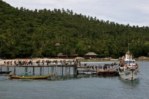 Travellers boarding a yacht ready to embark on one of the many Yacht Parties that take place on the islands around Thailand