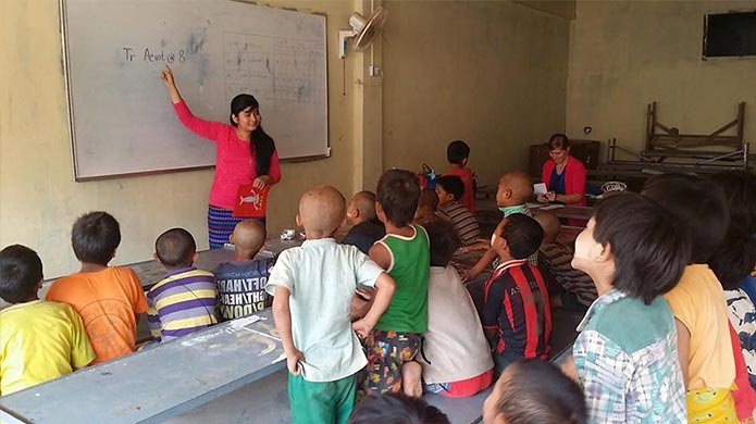 A teacher in her classroom in Myanmar.