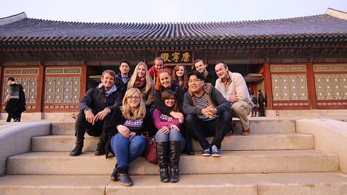 Teachers in South Korea on a cultural orientation tour at the Gyeongbokgung Palace.