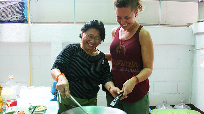 Learn how to cook traditional Thai food as part of your orientation in Thailand.