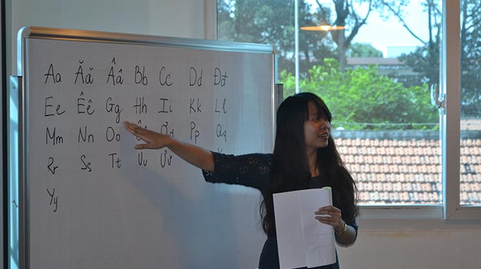 Instructors giving lessons on Vietnamese lessons 