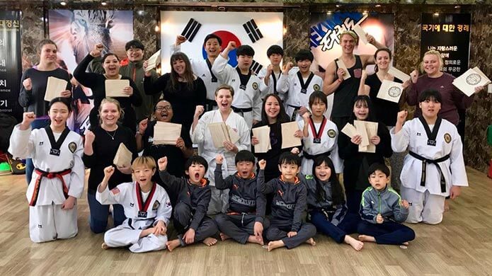 Students in South Korea with their certificates