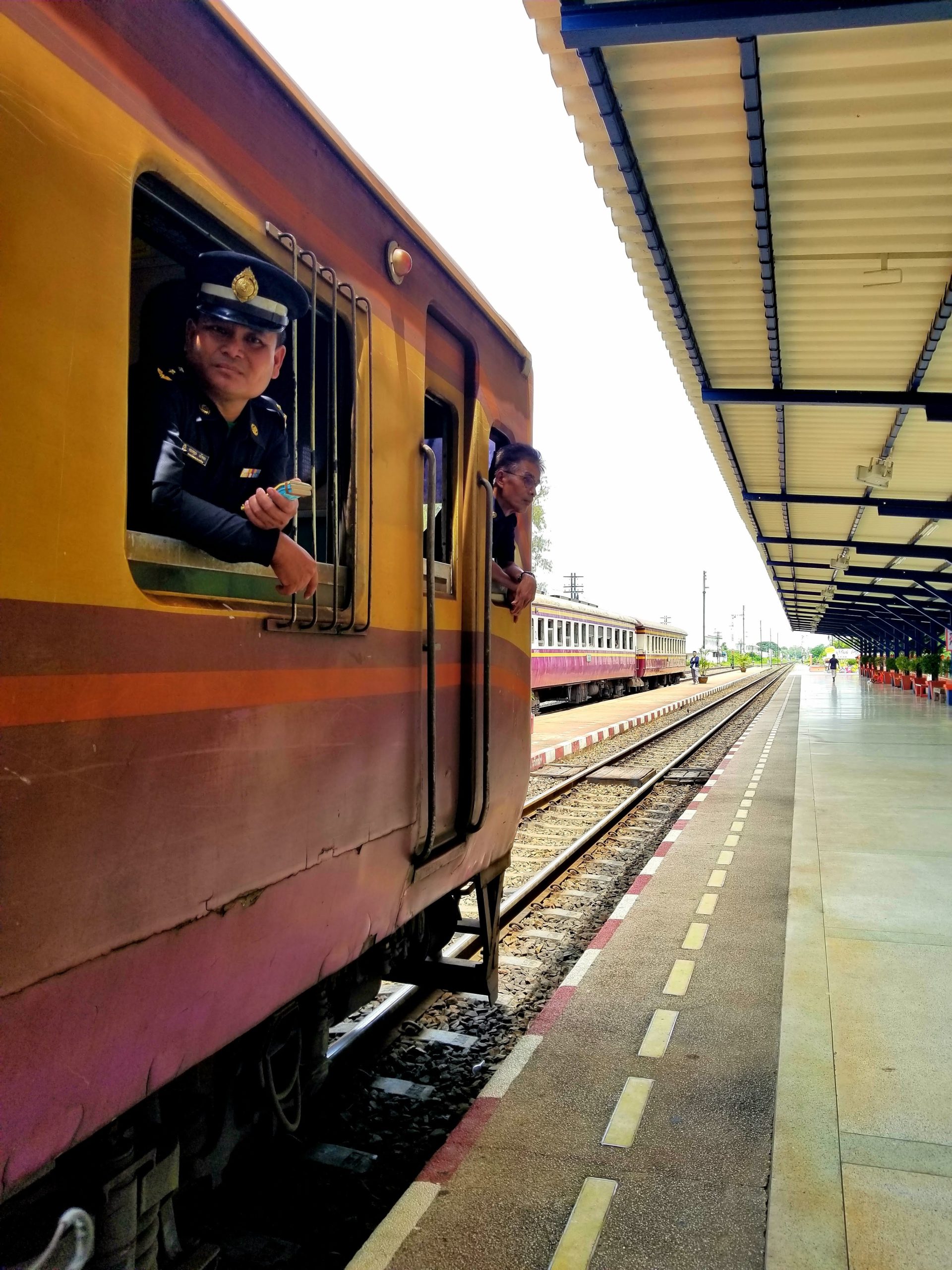 conductor with his head out of train window