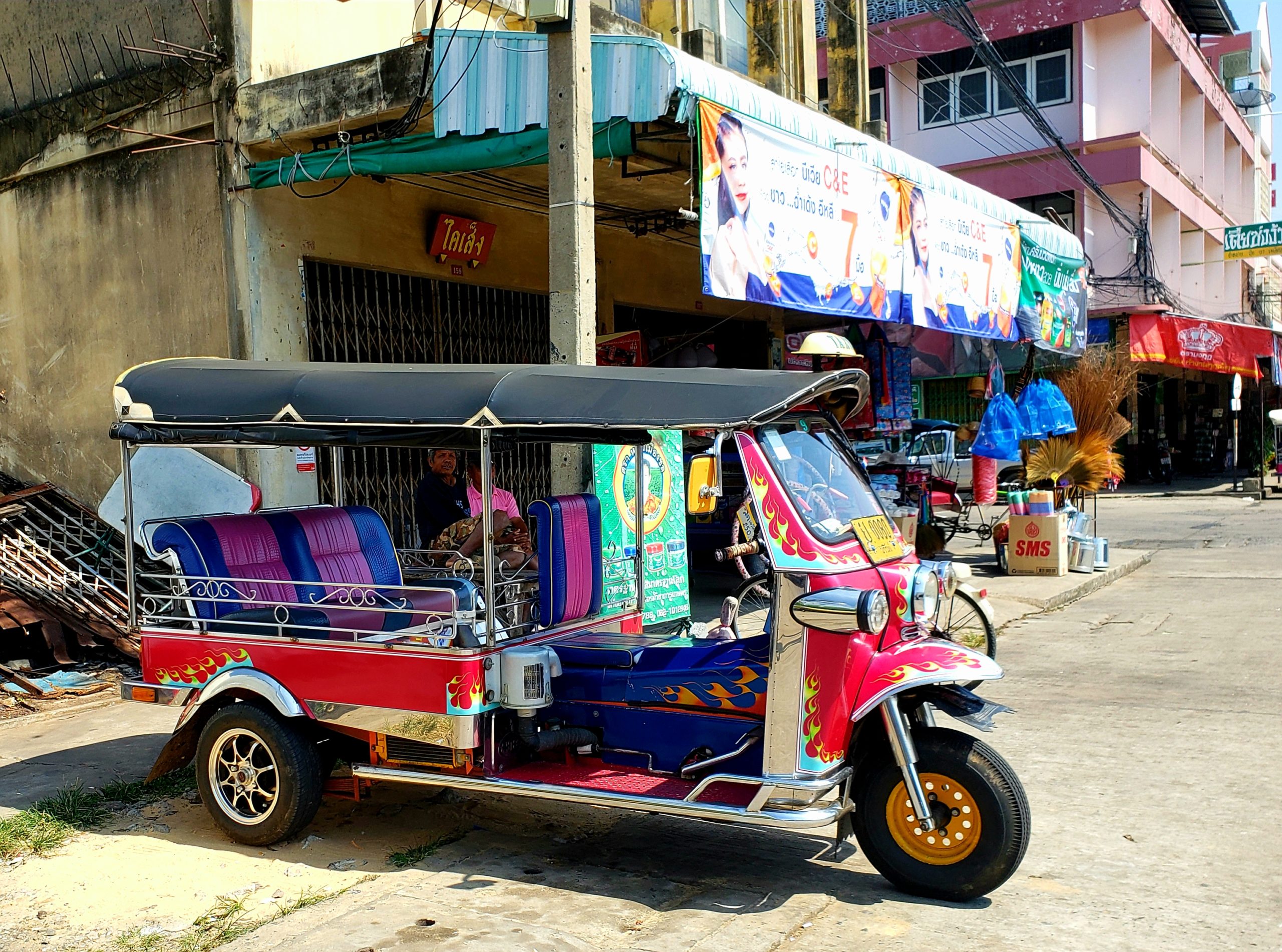 tuktuk parked on curb