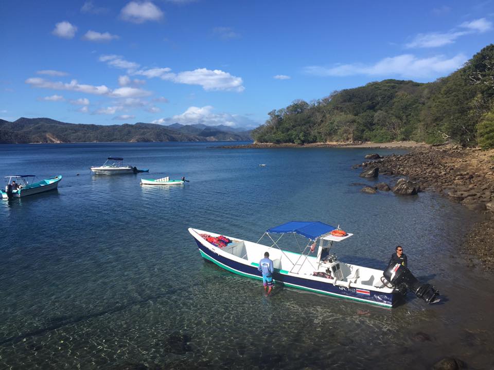 boat in costa rican water with islands in background