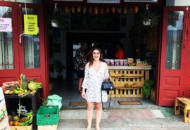 woman standing in front of Costa Rican shop