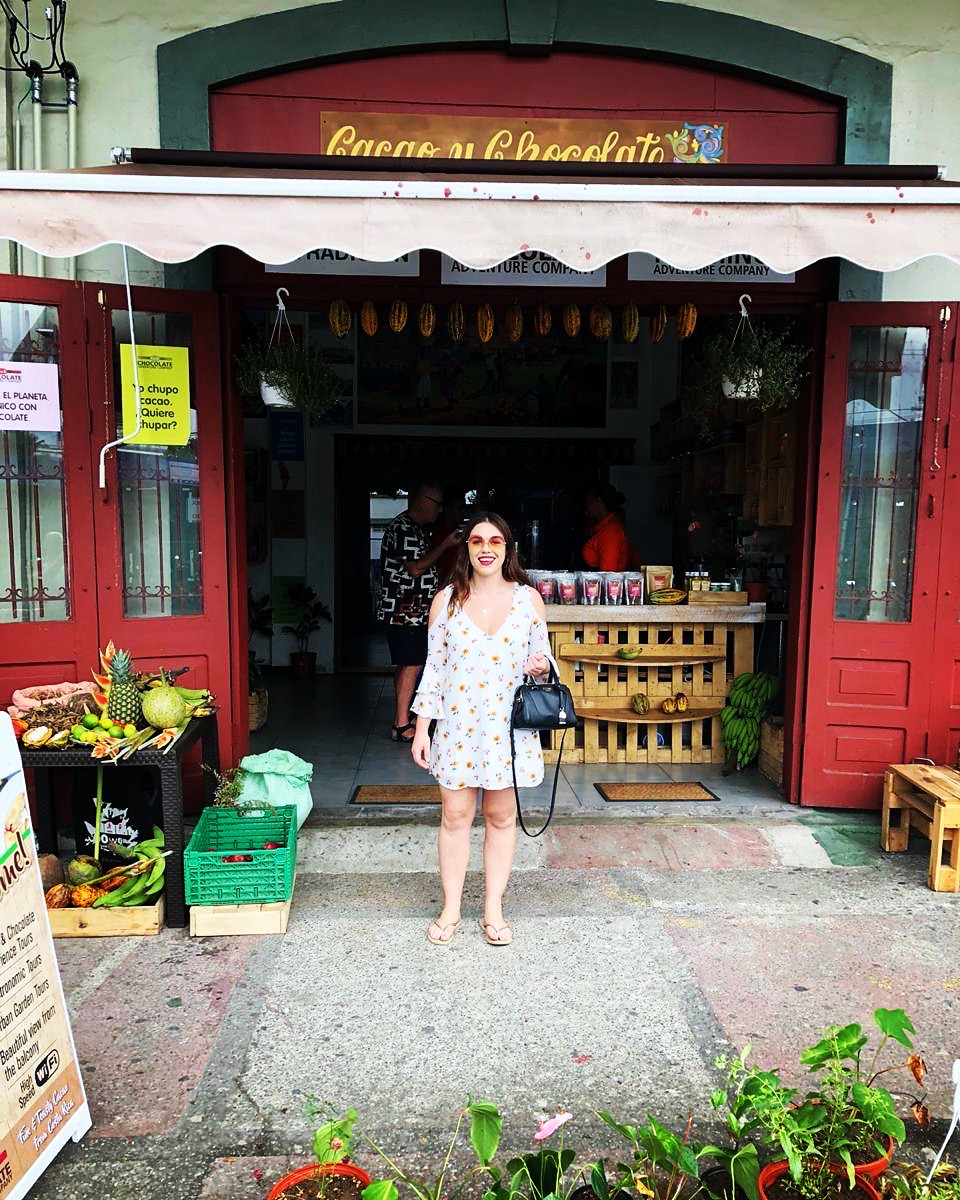 woman standing in front of Costa Rican shop