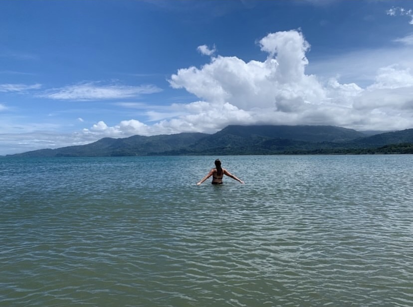 girl standing in water at costa rica beach