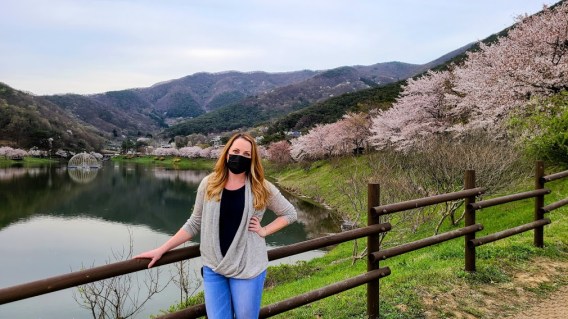 girl standing in front of mountains