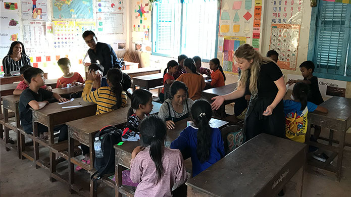 teacher in cambodian classroom